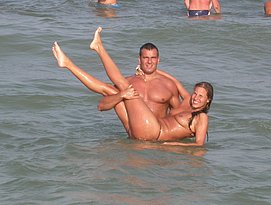 two tanned dudes fucking on the beach