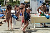 hot girl peeing in a bikini at the beach
